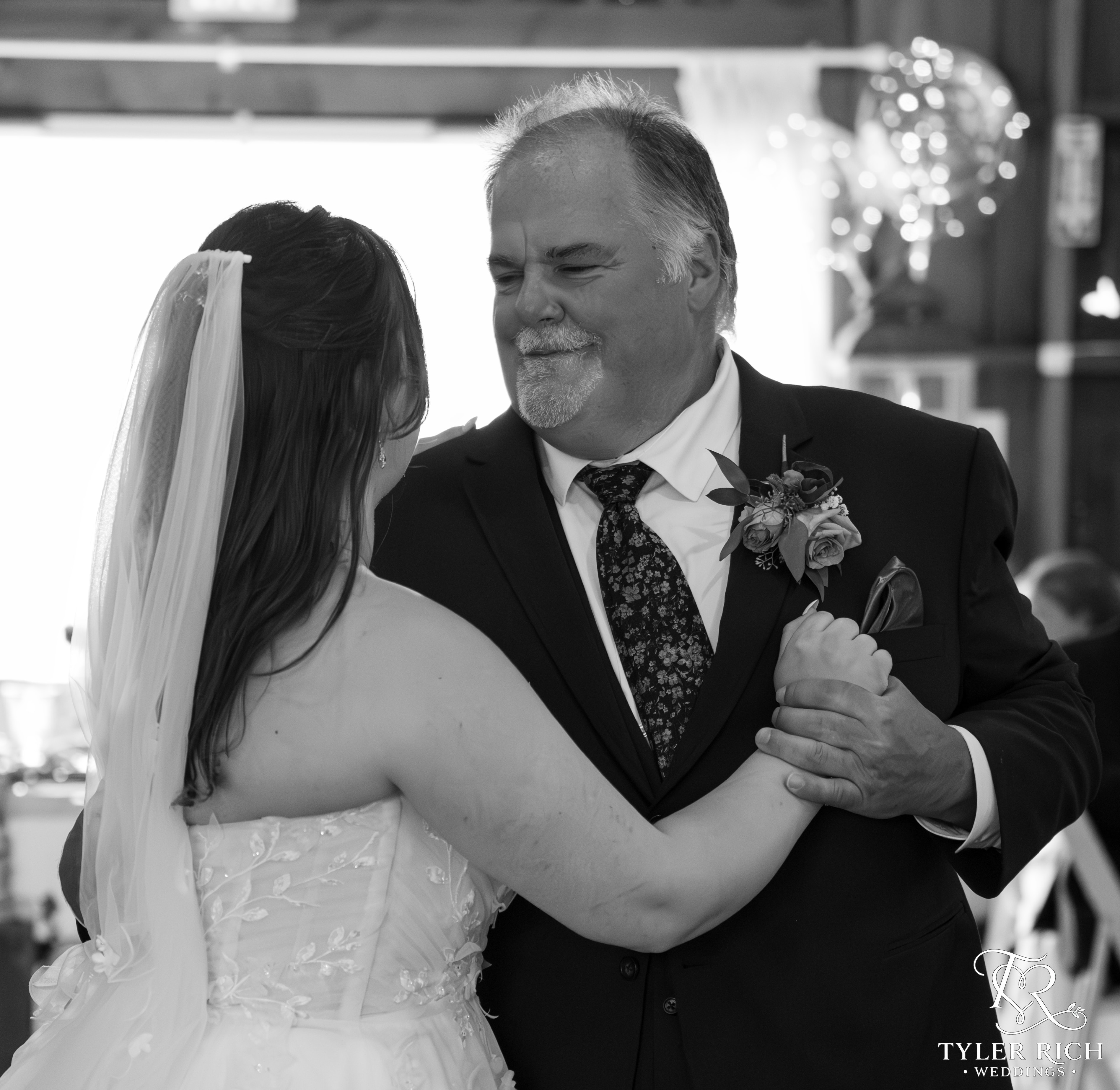 Father and daughter dancing at a wedding reception